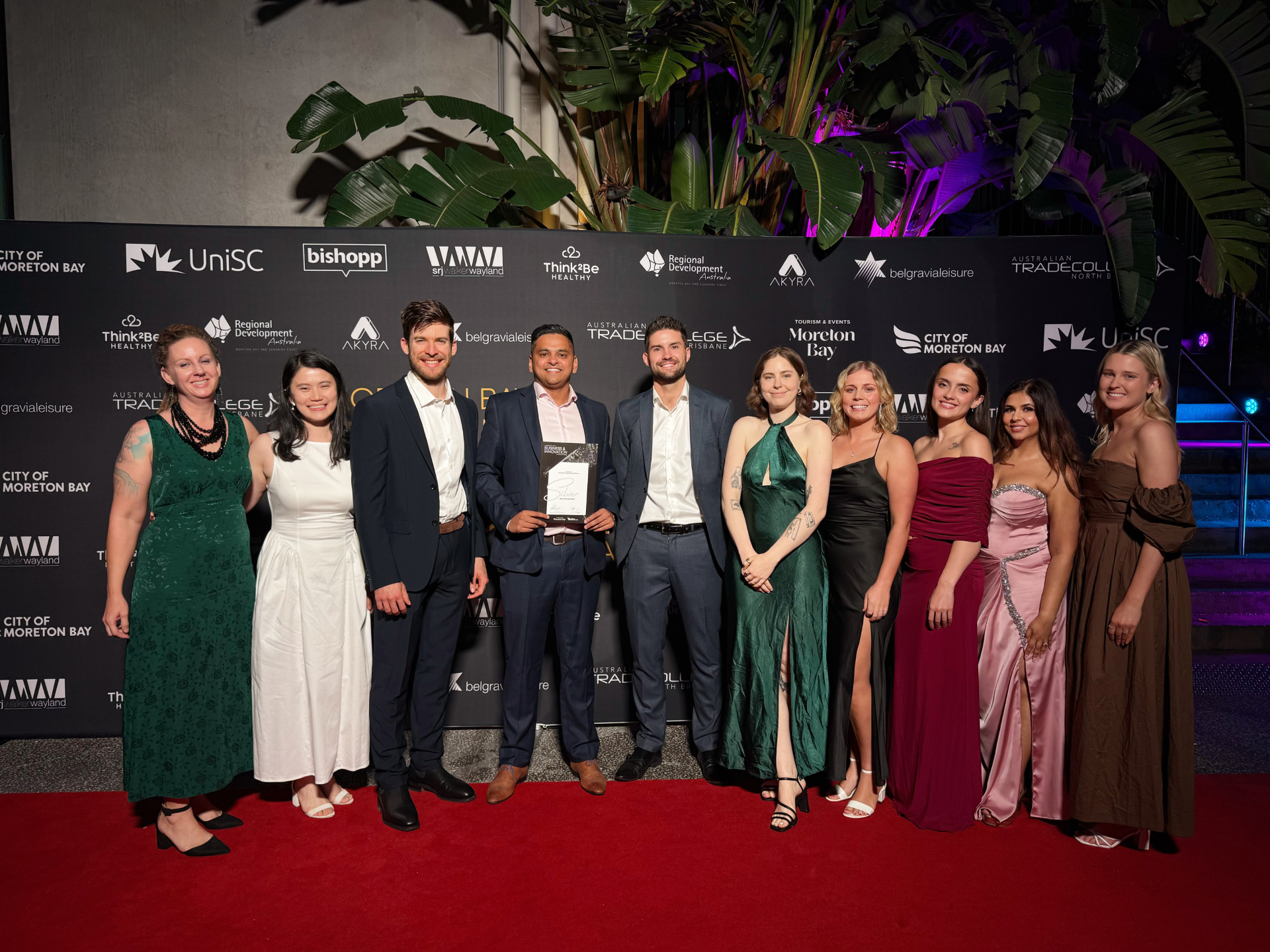 The Beachmere Dental team in formal wear on the awards red carpet, the night the practice won Silver for Best Customer Service